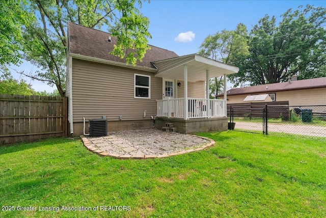 2914 W Holmes Rd, Lansing, MI 48911 - back of house featuring roof with shingles and a patio