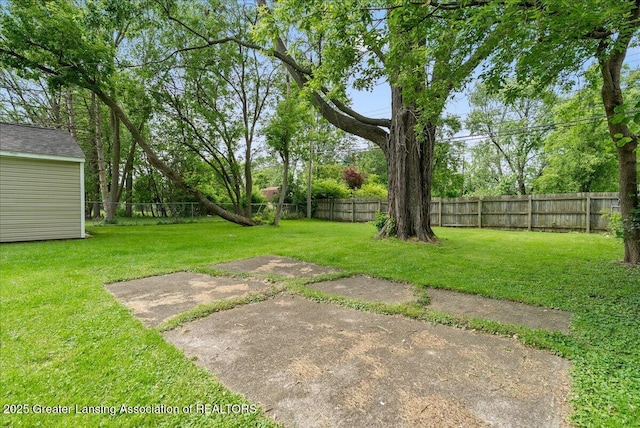 2914 W Holmes Rd, Lansing, MI 48911 - fenced backyard featuring a patio
