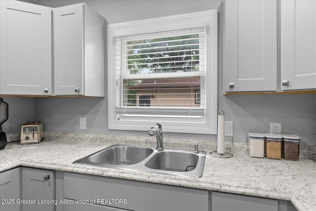 2914 W Holmes Rd, Lansing, MI 48911 - kitchen with a sink and light countertops