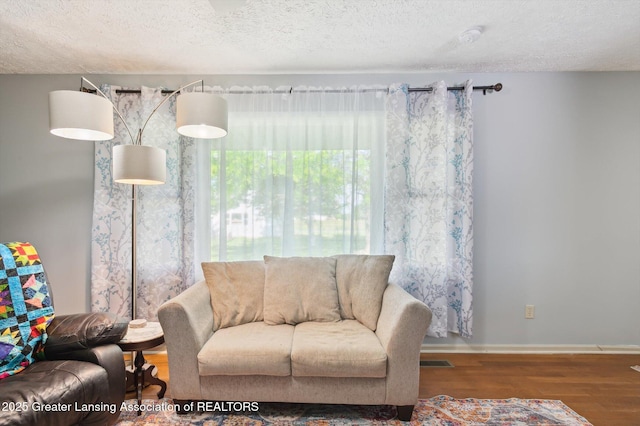1234 Lamb Rd, Mason, MI 48854 - living room with wood finished floors and a textured ceiling