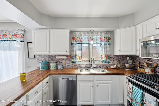 1234 Lamb Rd, Mason, MI 48854 - kitchen featuring wood counters, stainless steel appliances, decorative backsplash, and white cabinetry