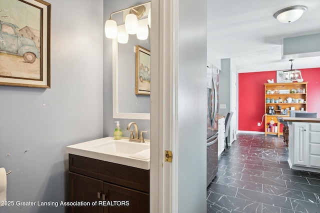 1234 Lamb Rd, Mason, MI 48854 - bathroom featuring vanity and marble look tile flooring
