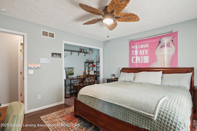 1234 Lamb Rd, Mason, MI 48854 - bedroom featuring wood finished floors, ceiling fan, and a textured ceiling