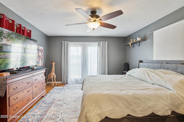 1234 Lamb Rd, Mason, MI 48854 - bedroom featuring light wood-style floors and ceiling fan