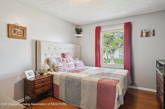 1234 Lamb Rd, Mason, MI 48854 - bedroom with wood finished floors and a textured ceiling