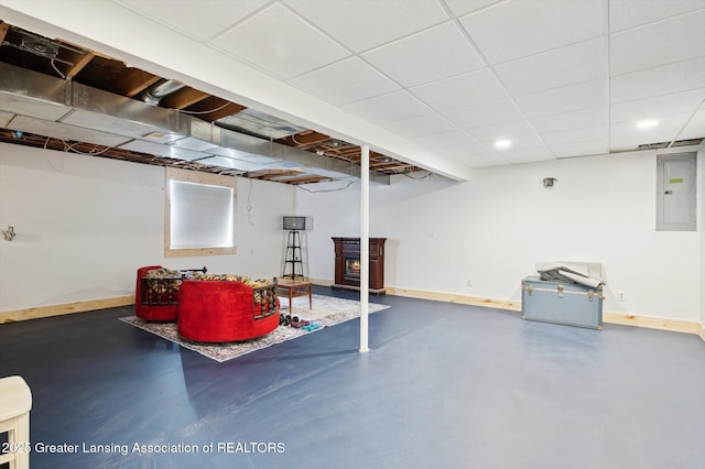 1234 Lamb Rd, Mason, MI 48854 - finished below grade area featuring electric panel, a wood stove, and recessed lighting