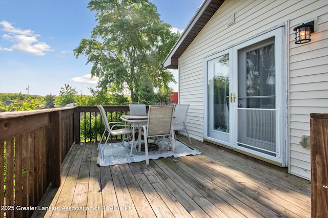 1234 Lamb Rd, Mason, MI 48854 - wooden deck with outdoor dining area