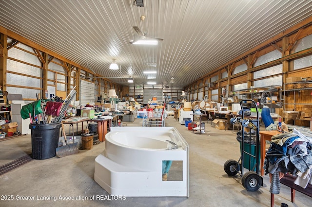 1234 Lamb Rd, Mason, MI 48854 - garage featuring a workshop area