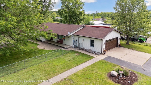 1234 Lamb Rd, Mason, MI 48854 - ranch-style home featuring driveway, a garage, a shingled roof, and a porch