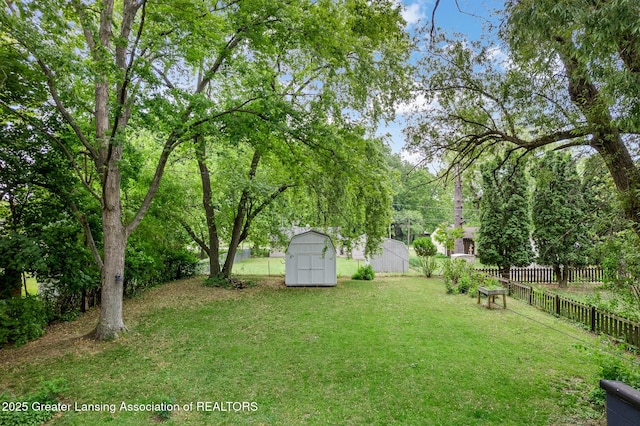 229 Rockingham Ave, Alma, MI 48801 - fenced backyard featuring a shed