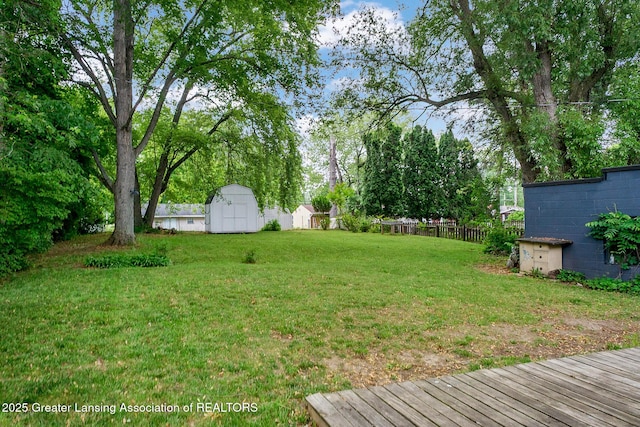 229 Rockingham Ave, Alma, MI 48801 - view of yard featuring a storage shed and view of scattered trees