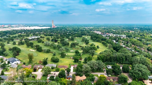 1717 Nottingham Rd, Lansing, MI 48911 - drone / aerial view of a tree filled landscape and a golf club