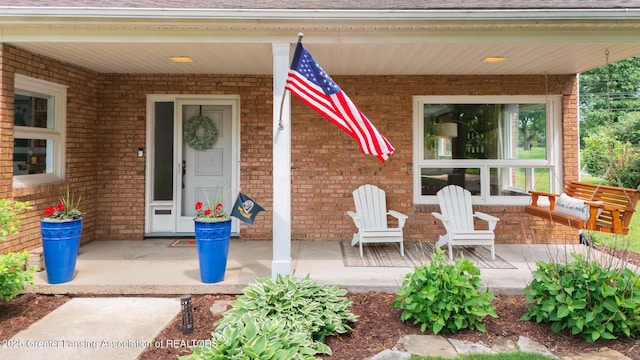 1717 Nottingham Rd, Lansing, MI 48911 - entrance to property with brick siding and covered porch