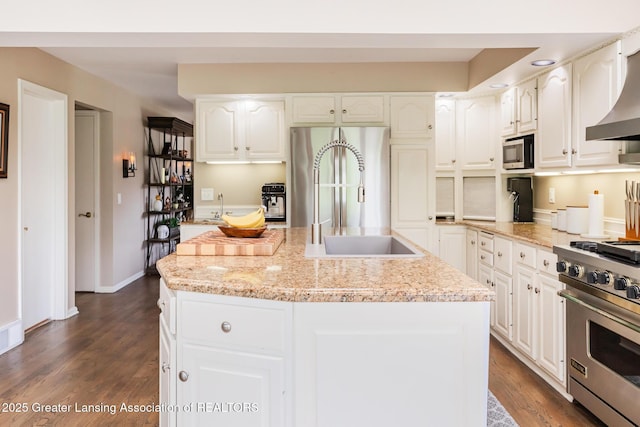 1717 Nottingham Rd, Lansing, MI 48911 - kitchen with stainless steel appliances, premium range hood, dark wood-style floors, and white cabinetry