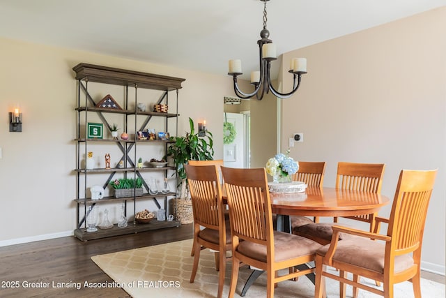 1717 Nottingham Rd, Lansing, MI 48911 - dining space featuring wood finished floors and a chandelier