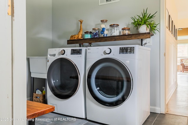 1717 Nottingham Rd, Lansing, MI 48911 - laundry area featuring separate washer and dryer