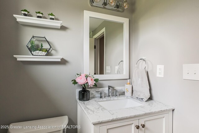 1717 Nottingham Rd, Lansing, MI 48911 - bathroom with vanity and toilet
