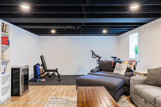 1717 Nottingham Rd, Lansing, MI 48911 - living area with wood finished floors and beverage cooler