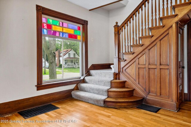 301 E Emerson St, Ithaca, MI 48847 - stairs featuring wood finished floors