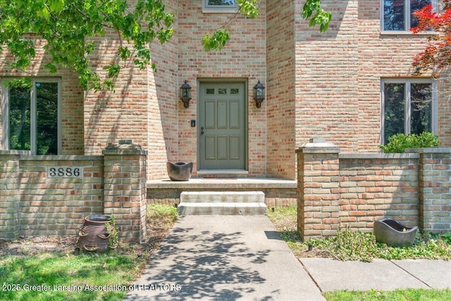 3886 Hemmingway Dr, Okemos, MI 48864 - doorway to property with brick siding