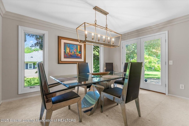 3886 Hemmingway Dr, Okemos, MI 48864 - dining space with healthy amount of natural light, ornamental molding, carpet flooring, and a chandelier