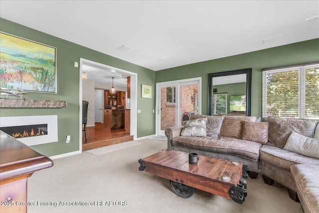 3886 Hemmingway Dr, Okemos, MI 48864 - living area featuring carpet and a glass covered fireplace