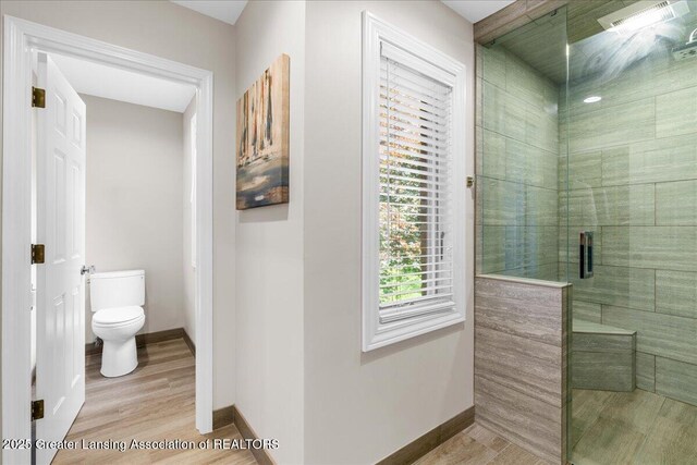 3886 Hemmingway Dr, Okemos, MI 48864 - full bathroom with a stall shower and wood finished floors