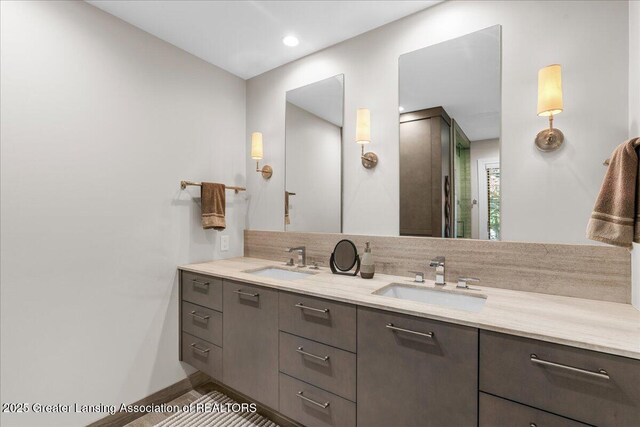 3886 Hemmingway Dr, Okemos, MI 48864 - bathroom with double vanity and baseboards