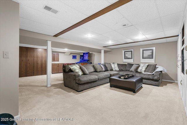 3886 Hemmingway Dr, Okemos, MI 48864 - carpeted living area featuring a drop ceiling and baseboards