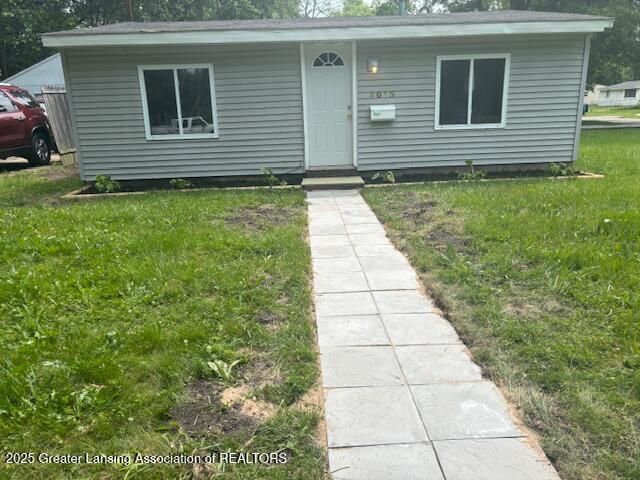 4013 Ingham St, Lansing, MI 48911 - view of front of home featuring a front lawn
