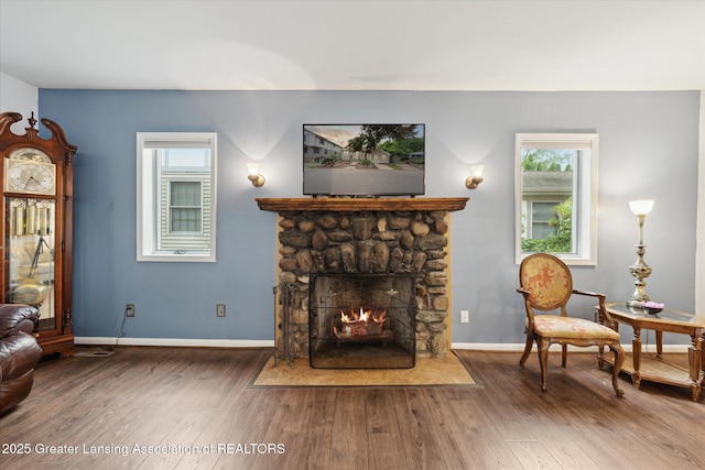 15754 Culver Dr, East Lansing, MI 48823 - living area with a fireplace and wood finished floors