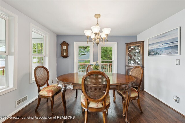 15754 Culver Dr, East Lansing, MI 48823 - dining area with a chandelier and dark wood-type flooring