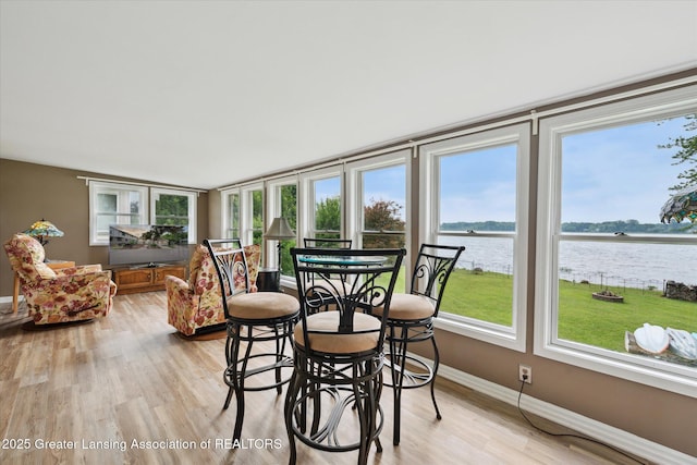 15754 Culver Dr, East Lansing, MI 48823 - sunroom / solarium featuring plenty of natural light and wood finished floors