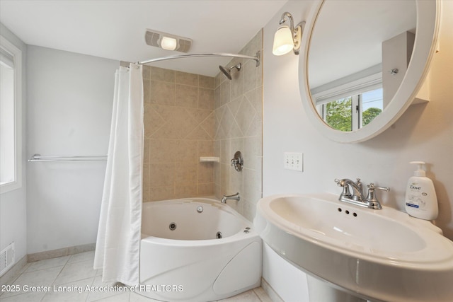 15754 Culver Dr, East Lansing, MI 48823 - full bathroom with a combined bath / shower with jetted tub and tile patterned floors