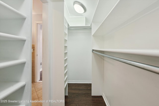 15754 Culver Dr, East Lansing, MI 48823 - walk in closet with wood finished floors