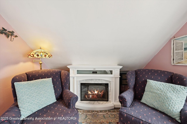 15754 Culver Dr, East Lansing, MI 48823 - sitting room with vaulted ceiling and a fireplace