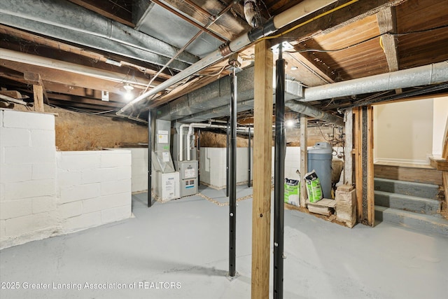 15754 Culver Dr, East Lansing, MI 48823 - unfinished basement featuring heating unit and a water softener system