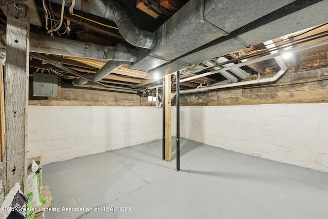 15754 Culver Dr, East Lansing, MI 48823 - unfinished below grade area featuring electric panel and concrete block wall
