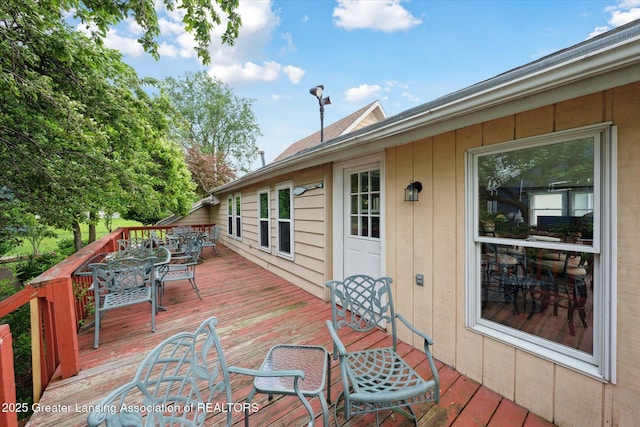 15754 Culver Dr, East Lansing, MI 48823 - wooden terrace with outdoor dining area