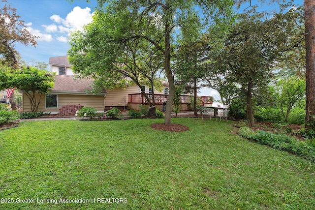 15754 Culver Dr, East Lansing, MI 48823 - view of grassy yard featuring a deck