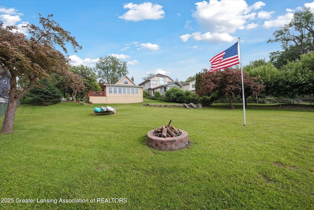 15754 Culver Dr, East Lansing, MI 48823 - view of green lawn with an outdoor fire pit