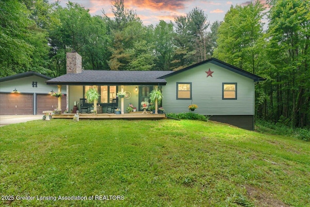 11100 S Bird Rd, Dowling, MI 49050 - single story home featuring a chimney, a lawn, an attached garage, and concrete driveway