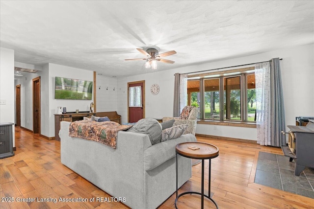 11100 S Bird Rd, Dowling, MI 49050 - living area with light wood finished floors and ceiling fan