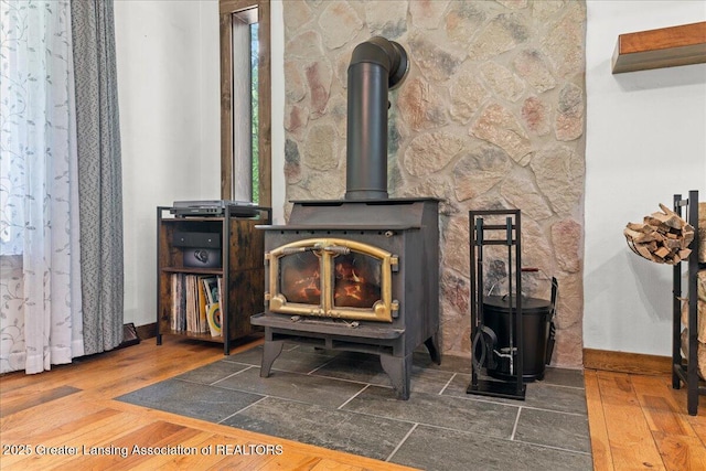 11100 S Bird Rd, Dowling, MI 49050 - detailed view of a wood stove and wood finished floors