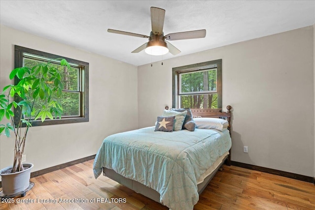 11100 S Bird Rd, Dowling, MI 49050 - bedroom featuring light wood-type flooring and ceiling fan
