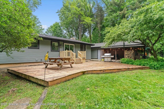 11100 S Bird Rd, Dowling, MI 49050 - rear view of house with a lawn, a wooden deck, and a chimney