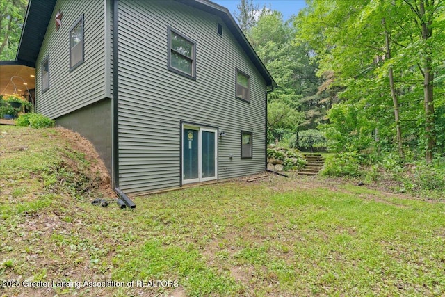 11100 S Bird Rd, Dowling, MI 49050 - rear view of property with a yard