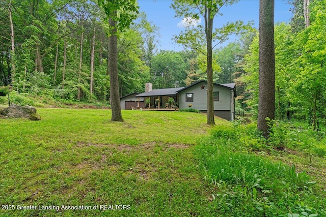 11100 S Bird Rd, Dowling, MI 49050 - view of green lawn with a view of trees