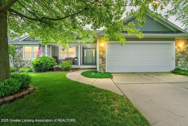 2308 Keller Rd, Holt, MI 48842 - view of front of home featuring stone siding, driveway, covered porch, a front yard, and an attached garage