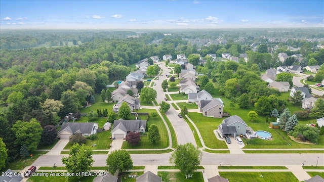 2308 Keller Rd, Holt, MI 48842 - aerial perspective of suburban area featuring a forest